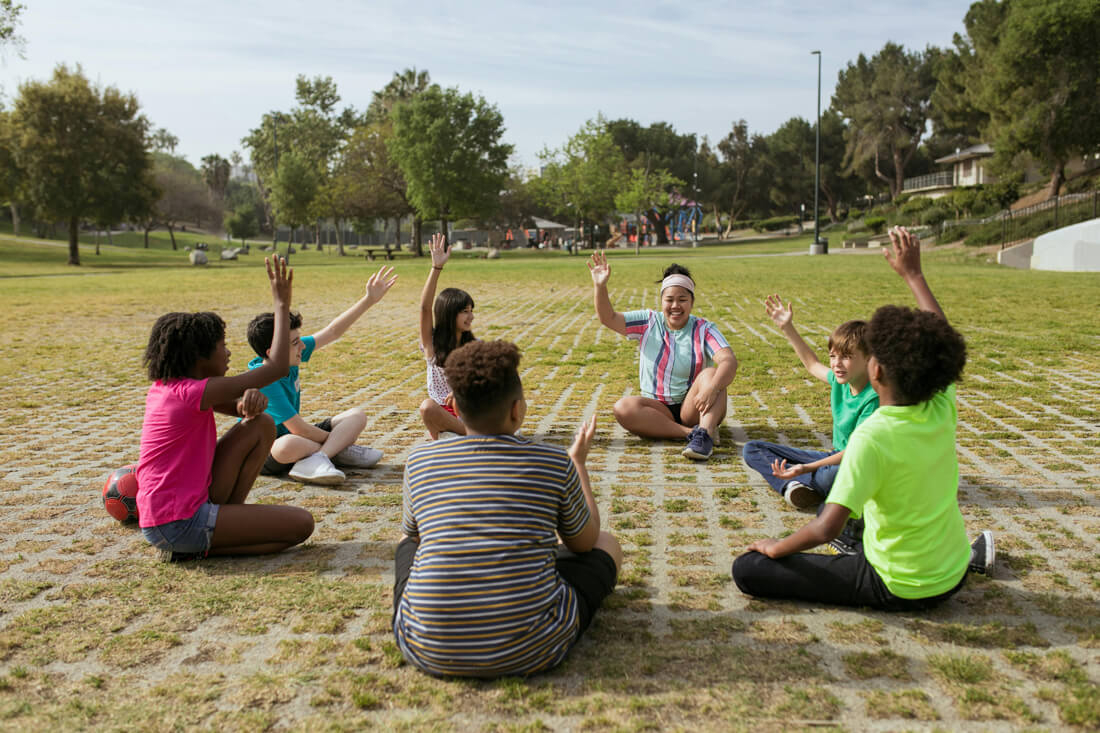 Children-sitting-in-open-space